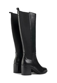 Black knee-high boots made of smooth leather with elastic fabric panels, block heels, and a rear zipper for easy wear.