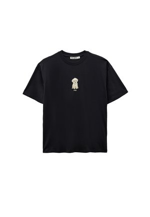 Musta lyhythihainen T-paita, jossa on keskellä rintaa pieni kirjailtu beige pentu ja sen alapuolella sana "puppy".