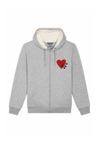 Grijze hoodie met rits en een zachte, crèmekleurige voering aan de binnenkant. Voorzien van een rood hartdesign met zwarte accenten op de linkerborst en twee zakken aan de voorkant.