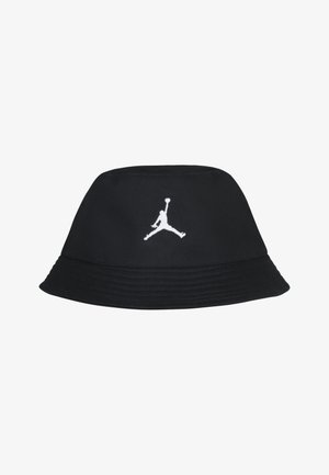 Chapeau seau noir en tissu, avec un logo Jumpman brodé blanc à l'avant, une large bordure et un design structuré.