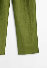 Right half of olive green linen pants leg with visible fabric texture on white background.