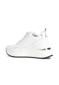 White sneaker with a sleek design, featuring a textured sole, metallic accents on the heel, and a smooth leather upper.
