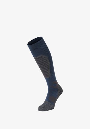 Knielange buitensokken gemaakt van donkerblauwe en grijze stof. Voorzien van gepolsterde gebieden en een geribbelde bovenrand voor comfort en ondersteuning.