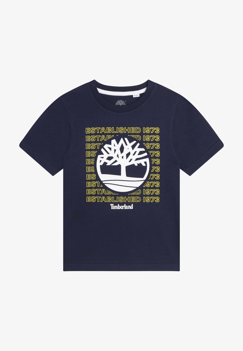 Námořnická modrá bavlněná tričko s bílým logem stromu a žlutým nápisem "ZALOŽENO 1973", kulatý výstřih, krátké rukávy a standardní střih.