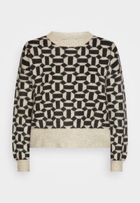 Maglione a maglia con un motivo geometrico in nero e crema. Design cropped con polsini e orlo a coste, texture morbida.
