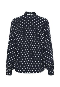 Blouse bleu marine à pois blancs, manches longues, poignets boutonnés et détail plissé dans le dos. Tissu doux avec une coupe décontractée.