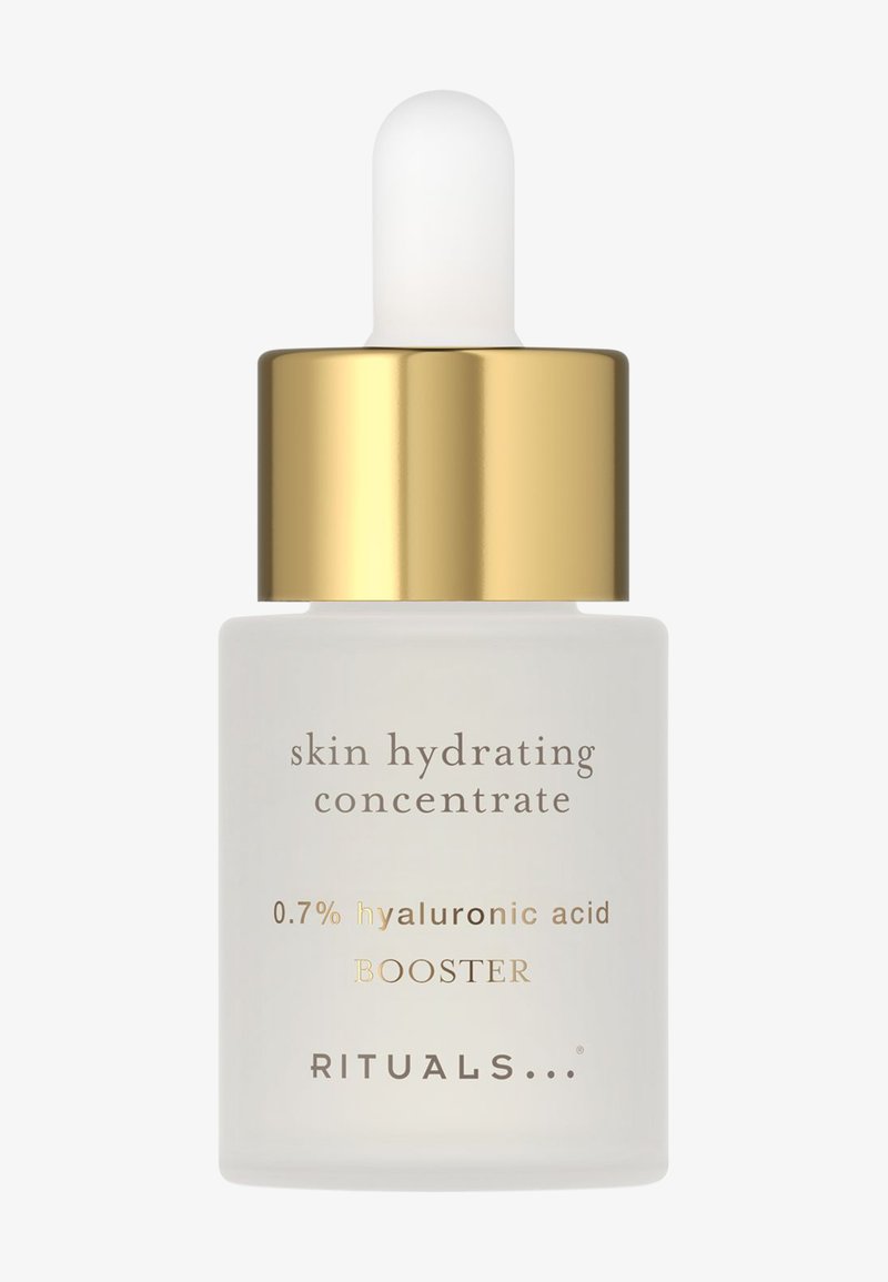 Flacon de concentré hydratant pour la peau avec un bouchon pipette doré contenant 0,7 % de booster d’acide hyaluronique par Rituals.