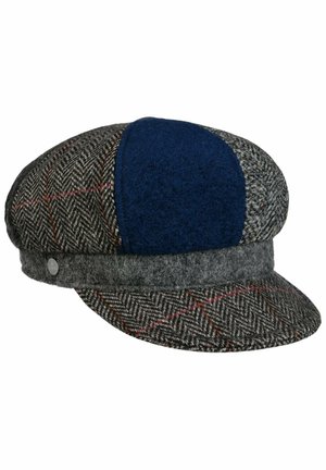 Herringbone wool flat cap with gray, navy blue, and red plaid panels, featuring a rounded crown and a short curved brim.