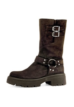 Dark brown suede mid-calf boot with two silver buckles at the top, a strap with metal ring and studs around the ankle, and chunky sole.