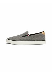 Gray slip-on shoes with a textured fabric upper, white rubber sole, and black and red accent details near the opening. Tan heel accent.