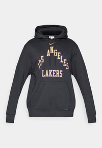 Juodas megztinis su kengūros kišene ir raišteliu ant kapučino. Pavaizduota "LOS ANGELES LAKERS" purpurinėmis ir baltomis raidėmis bei mažas geltonas Nike logotipas.