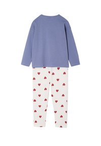 Cotton loungewear set featuring a light blue long-sleeve top and white pants with red heart patterns. Soft texture and relaxed fit.
