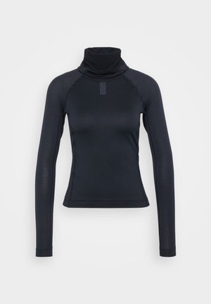 Haut à col roulé noir à manches longues avec un design ajusté, un motif côtelé texturé et un col haut. Fabriqué en tissu extensible et léger.