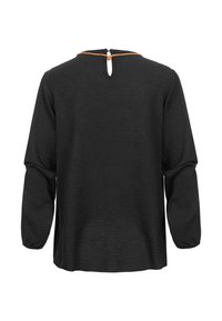 Black long-sleeve top with a textured finish, featuring a keyhole back closure and a contrasting orange accent around the neckline.