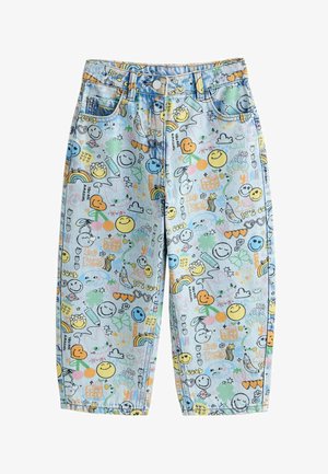 Pantalon en denim bleu clair avec des visages souriants colorés, des arcs-en-ciel, des cœurs, des fleurs et des mots positifs tels que "Sois gentil" et "Tu es incroyable" imprimés partout.