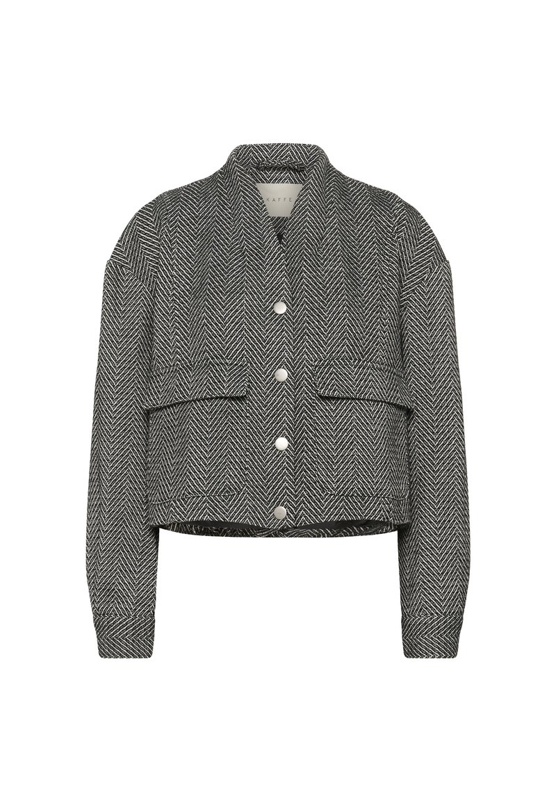 Chaqueta corta abotonada con estampado de espiga en blanco y negro, mangas largas y dos bolsillos delanteros con solapa.