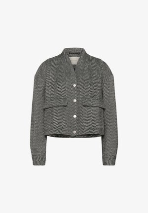 Lühi jakk must-valge tikkpattternis, millel on krae ja hõbedased nööbid, sisaldab kahte esitaskut ja pikki varrukasid.