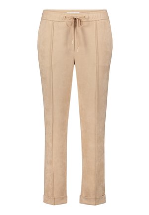 Beige Jogginghosen aus weichem, samtähnlichem Material, mit einem elastischen Bund und Kordelzug sowie Bündchen an den Säumen. Vertikale Nahtdetails.