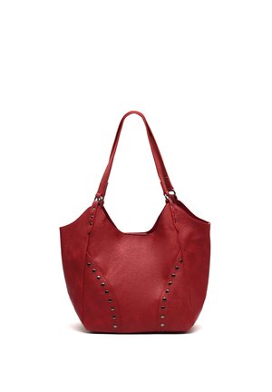 Red leather handbag with double shoulder straps and metal studs arranged in curved lines on the front.