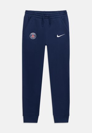 Pantalon de survêtement bleu marine avec taille élastique et cordon, logo Paris Saint-Germain sur la cuisse gauche, logo blanc Nike sur la cuisse droite.
