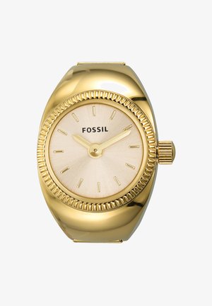 Gold-tone Fossil watch with a textured off-white dial, thin hour markers, and a crown. Features a rounded case with a ribbed bezel.