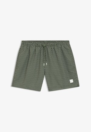 Zielone krótkie spodenki kąpielowe z elastycznym pasem, sznurkiem do ściągania i wzorem diamentowym, z małą białą etykietą po prawej stronie na dole.