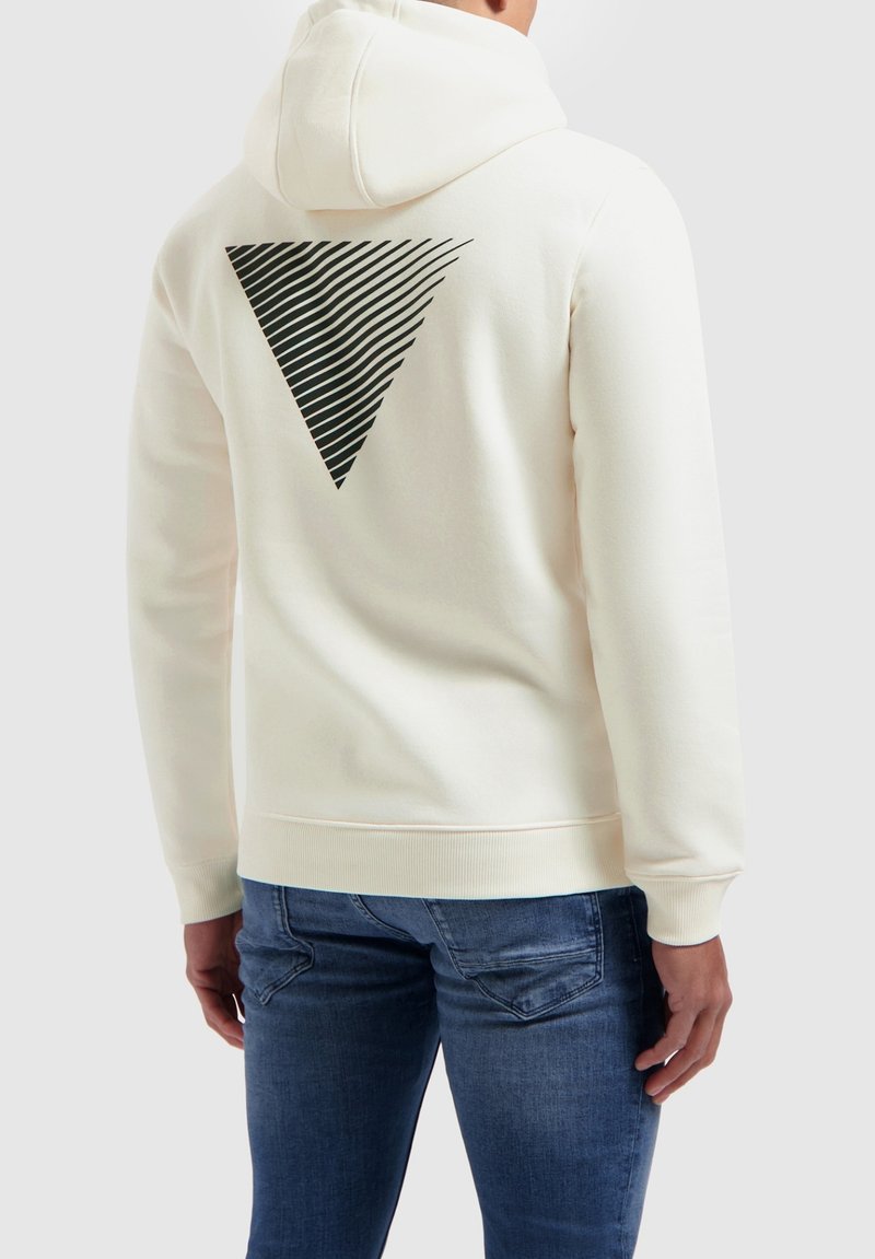 Crème hoodie met een gestructureerde zwarte driehoekige grafiek op de achterkant, voorzien van een kangoeroezak en ribgebreide manchetten en zoom.