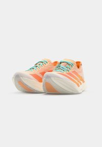Orange and peach running shoes feature turquoise laces and white soles, angled to showcase the design and branding details.