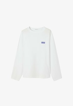 Bela majica z dolgimi rokavi iz bombaža, z majhnim modrim napisom »American Vintage« na prsih, okroglo izrezom in sproščenim krojem.