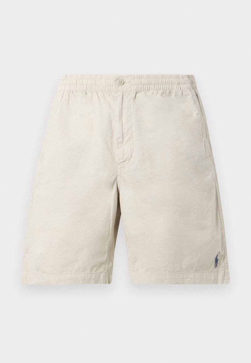 Shorts décontractés beige avec taille élastique, fermeture par bouton, poches latérales, et un petit logo sombre brodé près de l'ourlet sur la jambe droite.