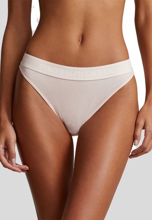 Beige ribota bikini apakšbikses ar mīkstu jostasvietu, kurai ir iegriezts "Polo Ralph Lauren" logo. Gluda tekstūra un augsts kāju izgriezums.