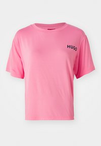 Pink cotton t-shirt with a relaxed fit, round neckline, and short sleeves. Features the text "HUGO" in black on the left chest.