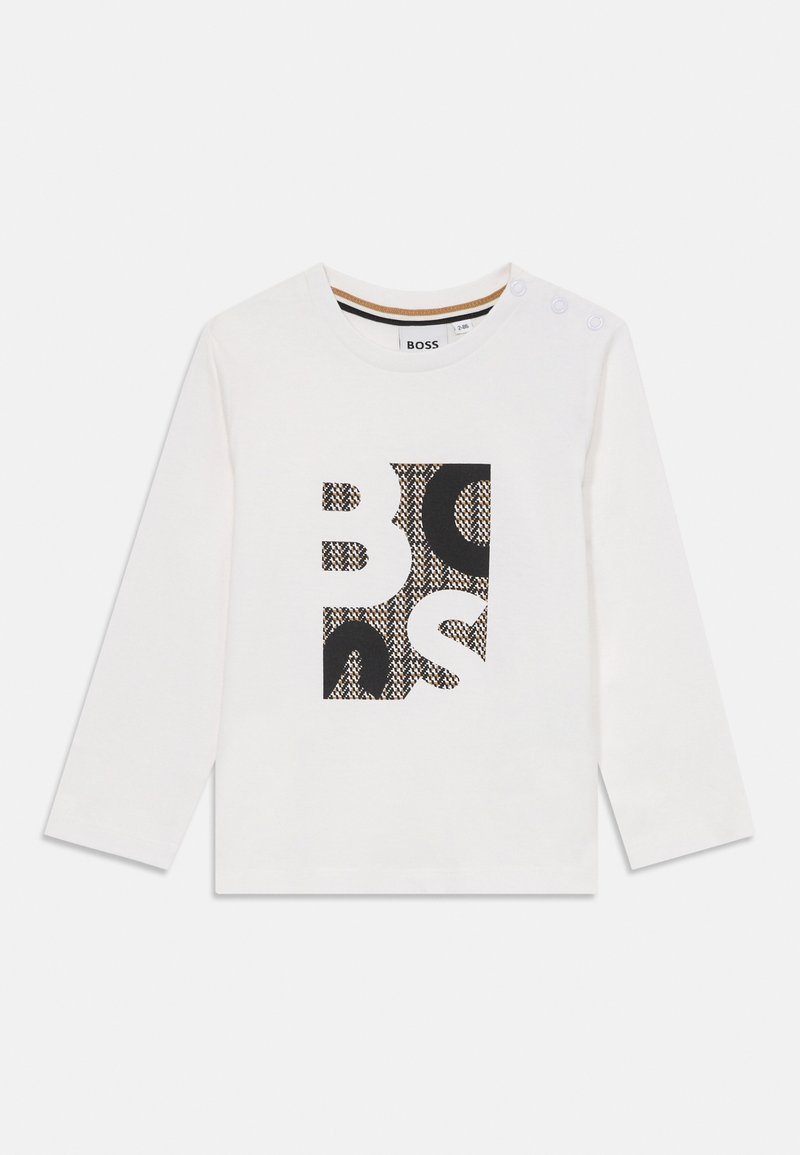 T-shirt blanc à manches longues avec un motif graphique noir et imprimé au centre, encolure ronde et trois boutons pression sur l'épaule.