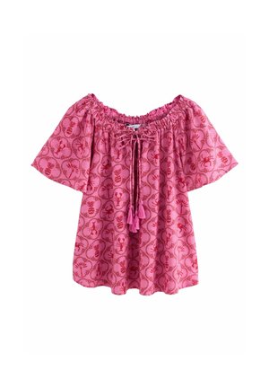 Haut rose décolleté avec des manches courtes, motif floral, encolure élastique et pompons roses à l'avant. Fabriqué en tissu léger.