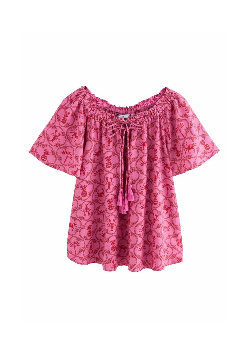 Top rosa off-the-shoulder con maniche corte, motivo floreale, scollatura elastica e pon-pon rosa frontali. Realizzato in tessuto leggero.