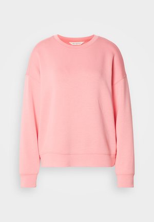 Hanorac roz, cu guler rotund, design cu umeri căzuți, manșete și tiv cu nervuri. Textură de țesătură netedă, cu o croială lejeră.