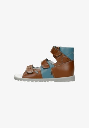 Brown and blue leather high-top sandal with two adjustable Velcro straps, open sides, and a white toe cap. Features a textured gray sole.