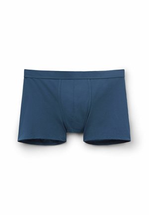 Blauwe katoenen boxershorts met een aansluitend ontwerp, elastische tailleband en een enkele naaddetail aan de voorkant. Zachte textuur.