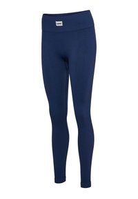 Mörkblå ribbstickade leggings med bred midjeresår och en liten varumärkeslapp sydd framtill. Slätt tyg med figurnära passform.