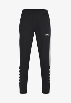Pantalon de sport noir avec des rayures verticales blanches sur les côtés, logo JAKO à l'avant et détails à boutons près du bas des jambes.