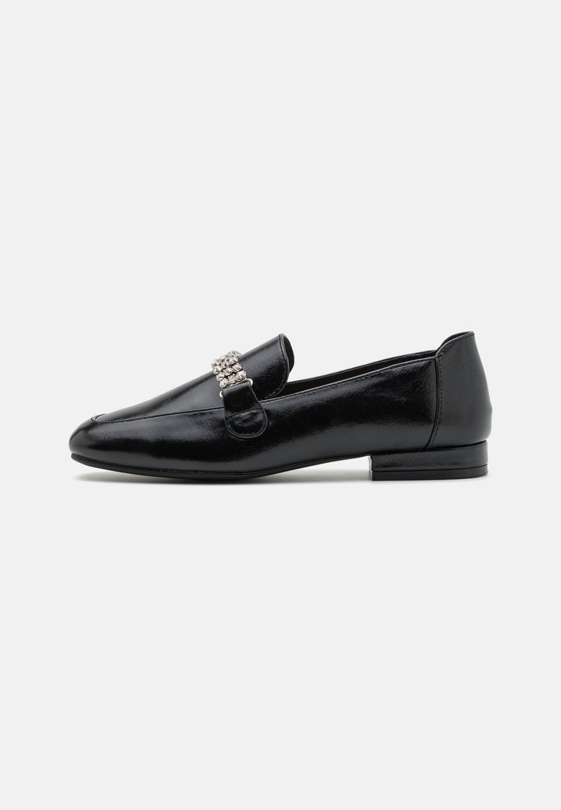 Black leather loafers with a low heel, featuring a decorative crystal buckle on the vamp. Smooth finish with rounded toe design.