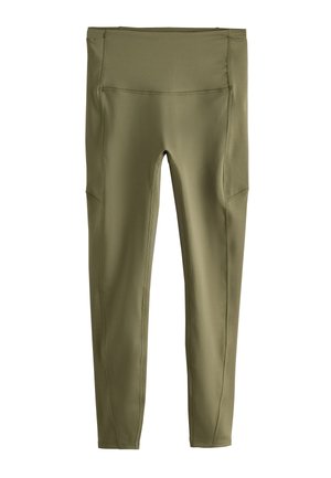 Mallas de cintura alta color oliva con costuras planas y bolsillos laterales, diseñadas para uso deportivo o casual.
