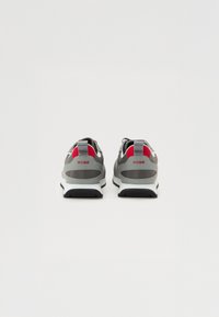 Gray sneakers with red accents, rubber soles, and a mesh upper. Features a logo on the heel and padded collar for comfort.