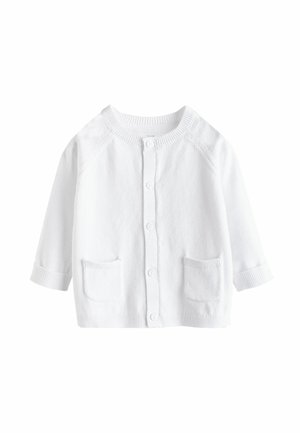 Cardigan bianco realizzato in morbido tessuto a maglia. Presenta colletto a coste, polsini e due tasche anteriori. Chiusura a bottoni al centro.