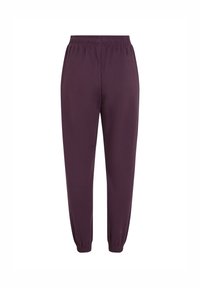 Paarse elastische joggingsbroek met een taps toelopende pijp, elastische boorden en een zachte stofstructuur. Ontworpen voor comfort en bewegingsvrijheid.