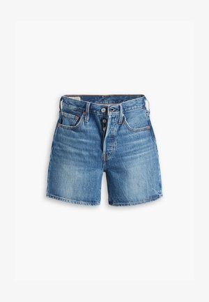 Τζιν σορτσάκι σε ανοιχτό μπλε χρώμα με πέντε κουμπιά στο φερμουάρ, θηλιές ζώνης και τέσσερις τσέπες. Φθαρμένη εμφάνιση με διακριτική φθορά σε όλη την επιφάνεια.