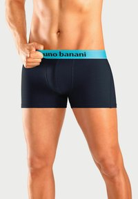 Men's boxer briefs in navy blue fabric with a light blue elastic waistband featuring the brand name "Bruno Banani" in black.
