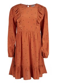 Vestido de color óxido con mangas largas, panel delantero con volantes, lunares negros y un dobladillo escalonado. Tejido suave, cierre trasero con apertura en forma de llave.