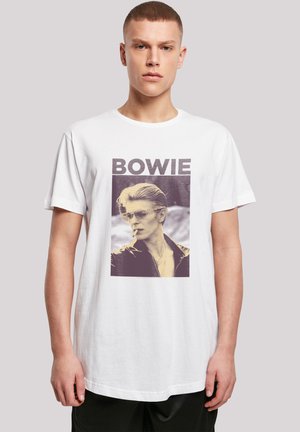 White cotton t-shirt featuring a graphic print of a person in sunglasses and a black jacket, with "BOWIE" text above in bold letters.