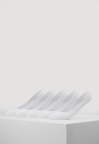 White ankle socks displayed in a row, featuring a smooth texture and low-cut design for minimal visibility when worn.